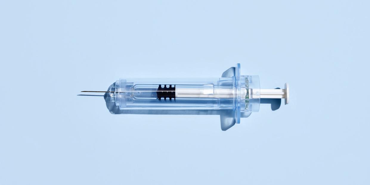 Syringe On Blue Background