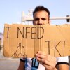 A fan holds a banner asking for a ticket outside the stadium prior to the 2022 FIFA World Cup final between Argentina and France at Lusail Stadium in Lusail City, Qatar, on Dec. 18, 2022. 