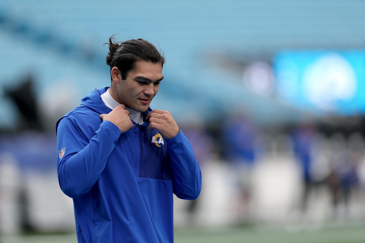 Rams wide receiver Puka Nacua warms up before a playoff game against the Carolina Panthers in January.