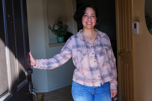 Anne King poses for a photo at the home she recently purchased, in Fort Worth, Texas, Tuesday, March 31, 2026. (AP Photo/LM Otero)