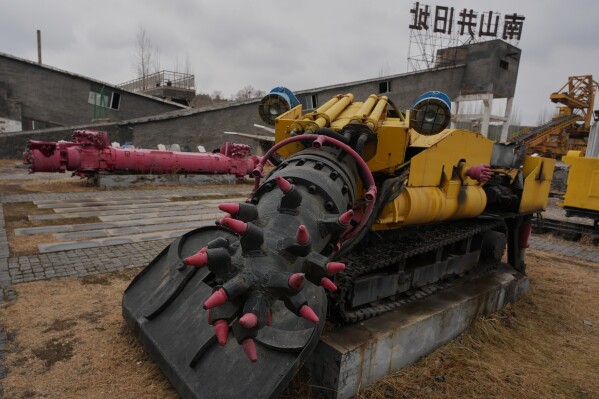 An old mining machinery is displayed at the Jinhuagong National Mine Park, a museum converted from a former section of the No. 9 mine, in Datong, China, Friday, March 13, 2026. (AP Photo/Ng Han Guan)
