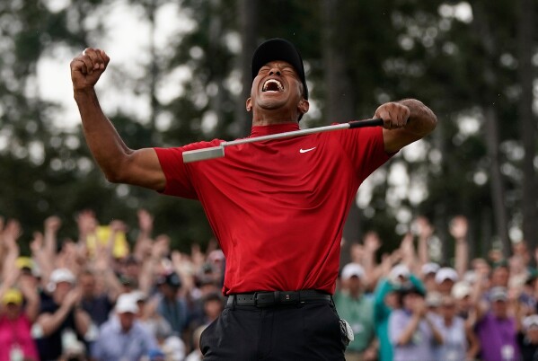 Tiger Woods reacts as he wins the Masters golf tournament April 14, 2019, in Augusta, Ga. (AP Photo/David J. Phillip, File)