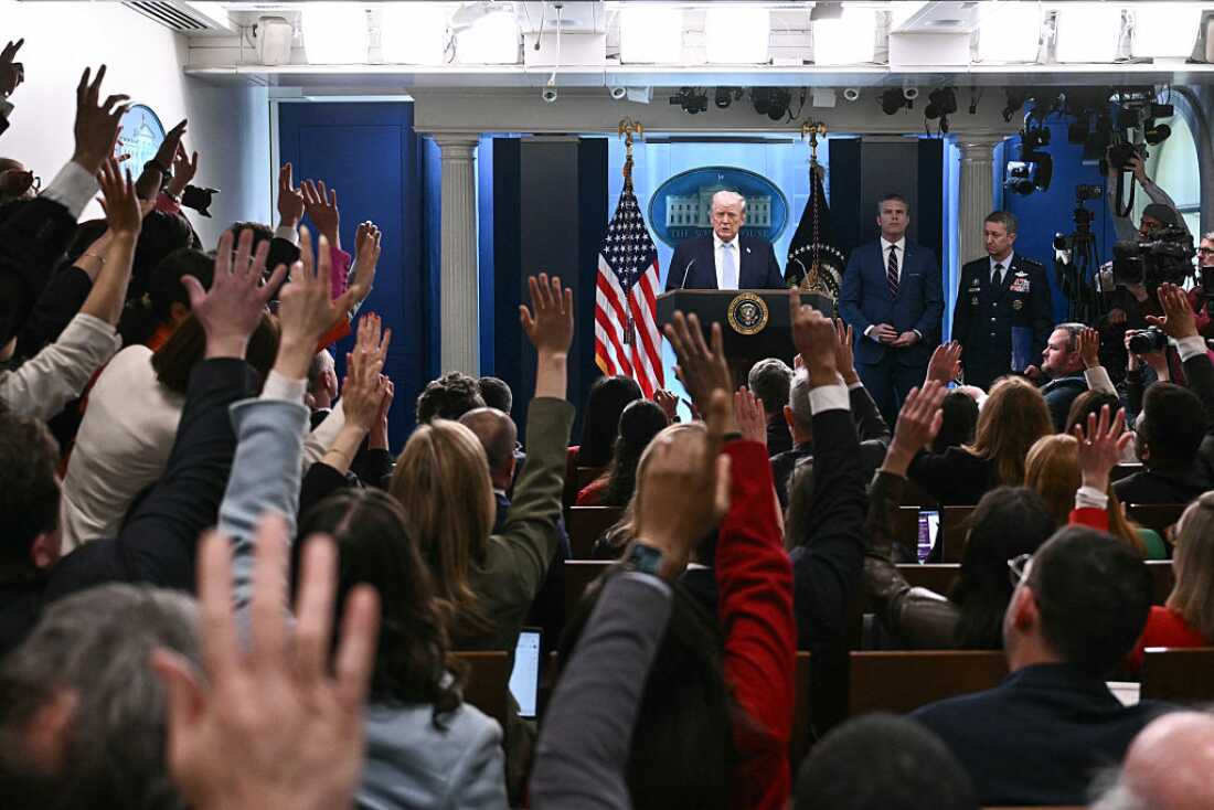 US President Donald Trump, alongside US Secretary of Defense Pete Hegseth (2R) and Chairman of the Joint Chiefs of Staff General Dan Caine (R), takes questions as he speaks about the conflict in Iran in the James S. Brady Press Briefing Room of the White House on April 6, 2026, in Washington, DC.