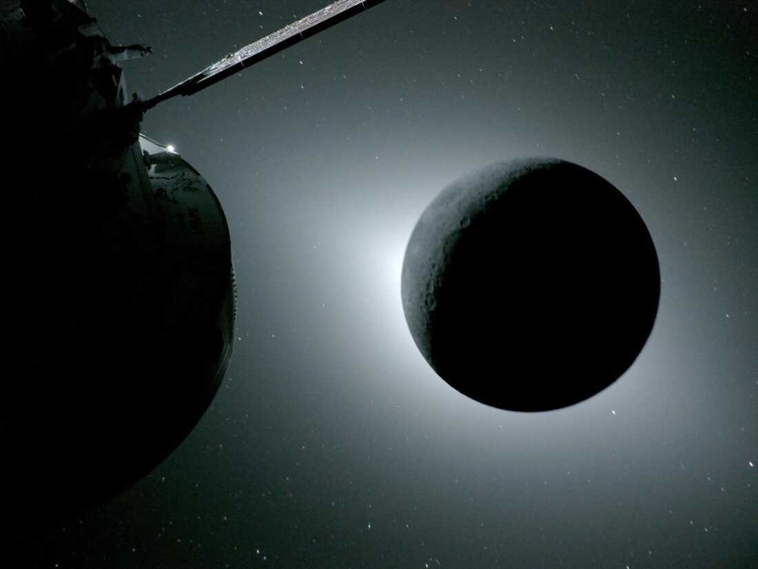 The moon, seen here backlit by the sun during a solar eclipse on Monday, is photographed by one of the cameras on the Orion spacecraft’s solar array wings