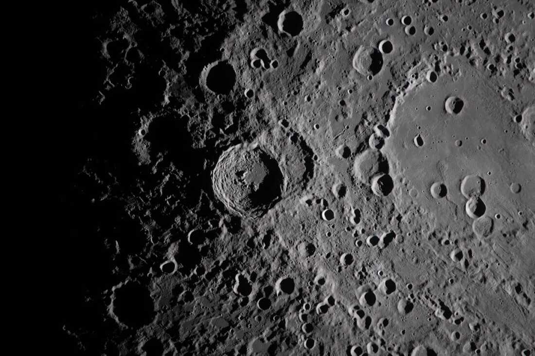 A close-up view taken by the Artemis II crew of Vavilov Crater on the rim of the older and larger Hertzsprung basin.