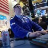 Traders work on the floor of the New York Stock Exchange during morning trading on April 02, 2026 in New York City.