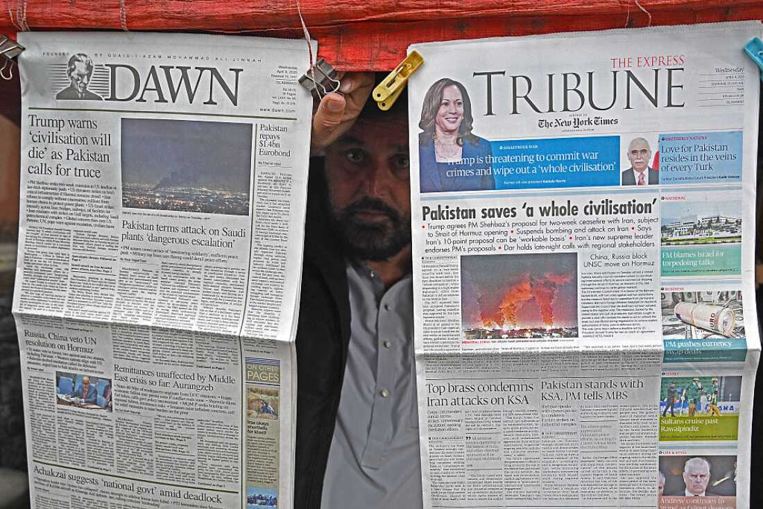 A vendor displays morning newspapers at his roadside stall in Islamabad on Wednesday. Pakistani Prime Minister Shehbaz Sharif said the United States, Iran and their allies had agreed to a ceasefire "everywhere," including Lebanon, following mediation by his government to stop weeks of fighting.