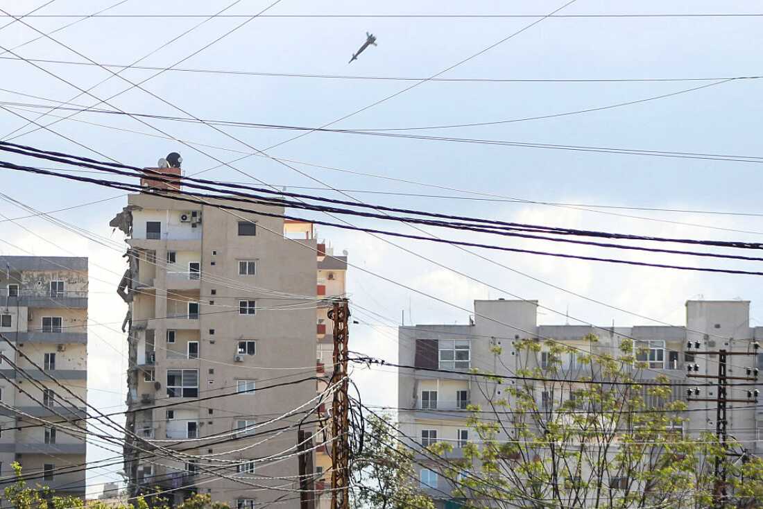 A projectile is seen moments before hitting a building during an Israeli airstrike in the area of Abbasiyeh, on the outskirts of the southern Lebanese city of Tyre, on Wednesday.