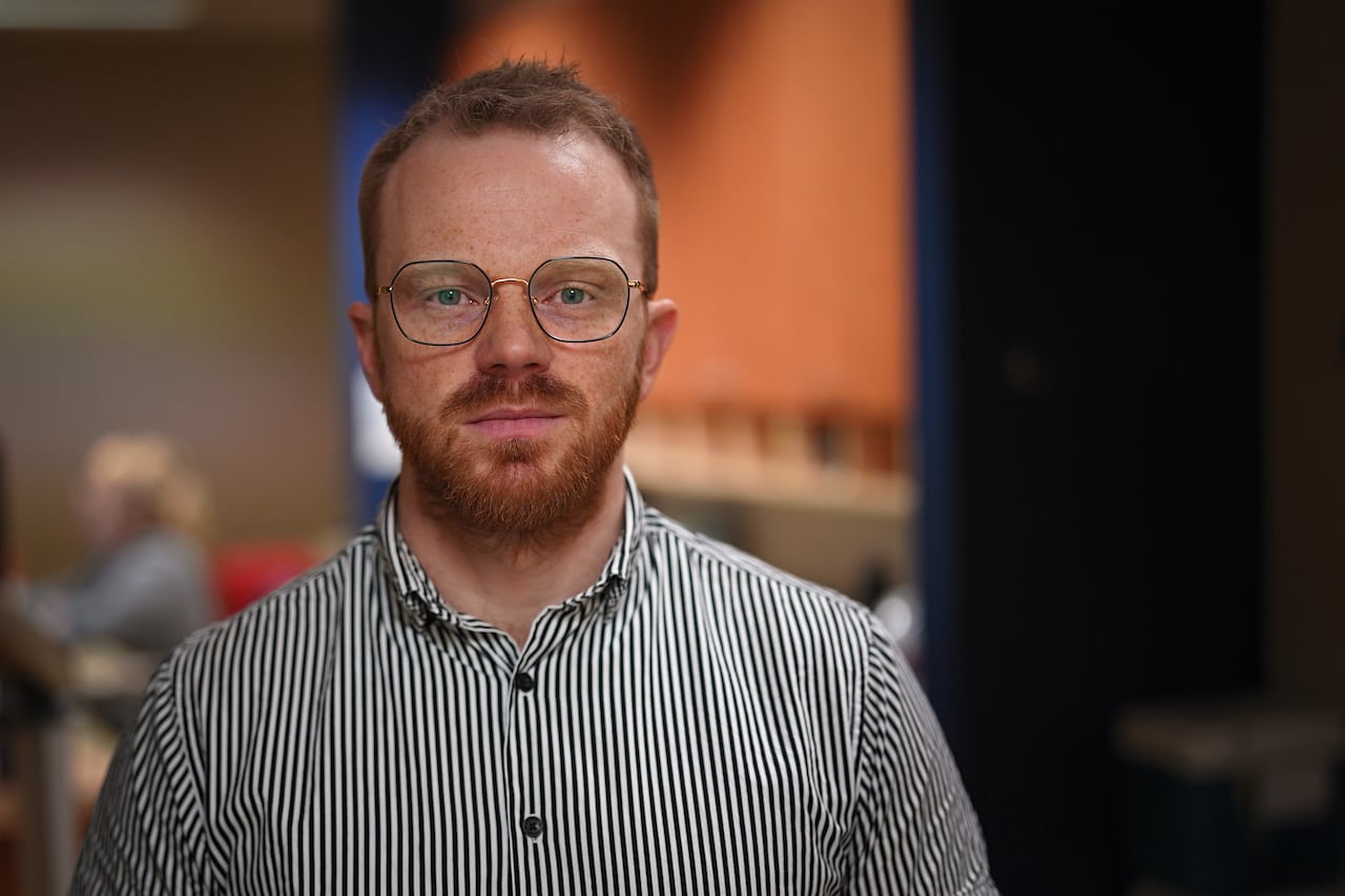 a man looks straight ahead 