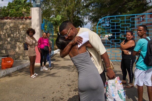 A pardoned prisoner hugs a family member outside La Lima penitentiary after his release in Guanabacoa, Havana, Cuba, Friday, April 3, 2026. (AP Photo/Ramon Espinosa, File)