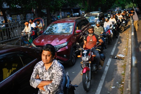 Motorists queue up outside a fuel pump in Dhaka, as Bangladesh tries to handle its energy crisis related to the Iran war, Sunday, April 5, 2026. (AP Photo/Mahmud Hossain Opu, File)
