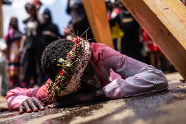 Christians take part in a Way of the Cross re-enactment of the crucifixion of Jesus Christ on Good Friday during Holy Week in Kibera informal settlement in Nairobi, Kenya, Friday, April 3, 2026. (AP Photo/Samson Otieno, File)