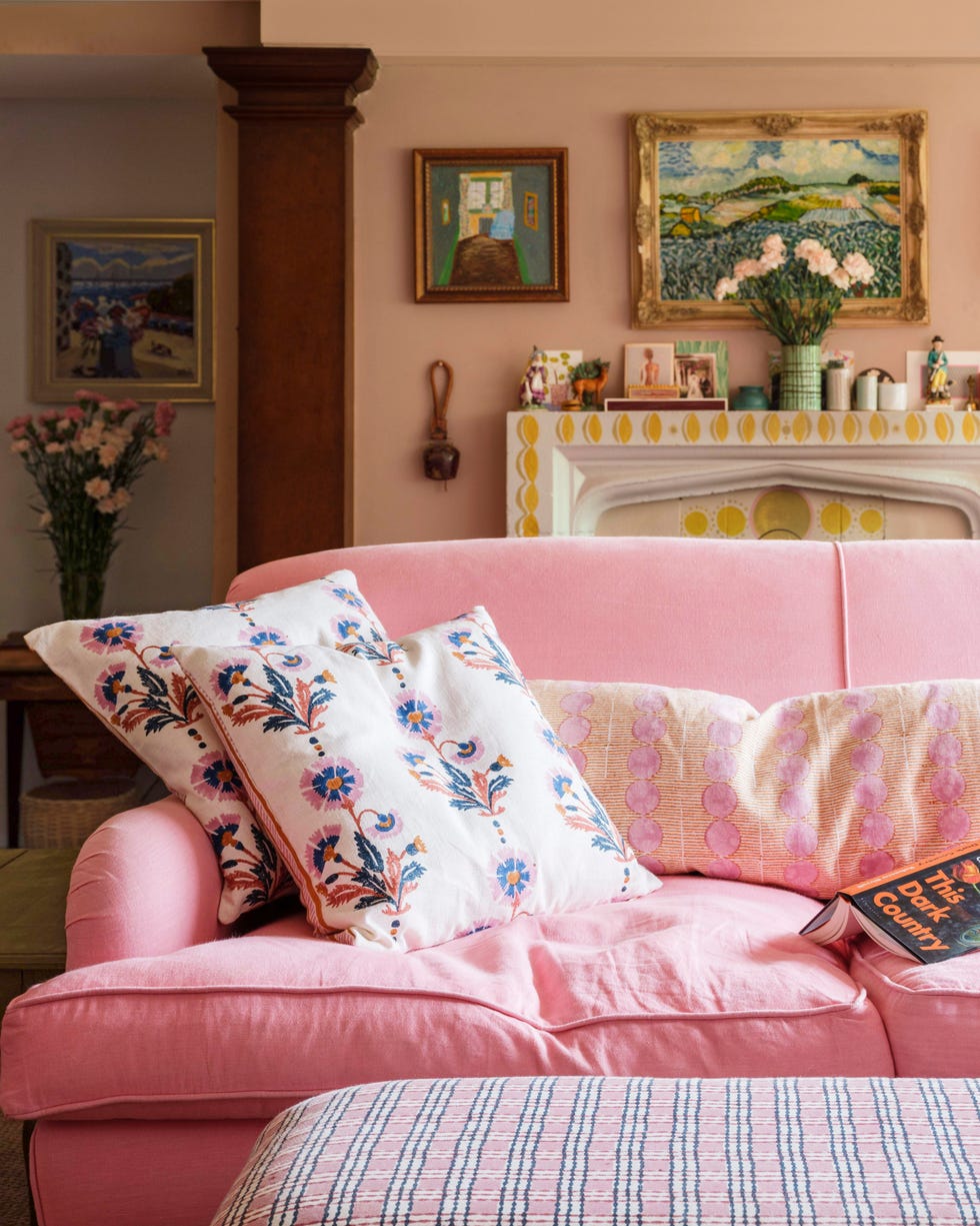 pink sofa in sitting room with throw pillows pink sofa