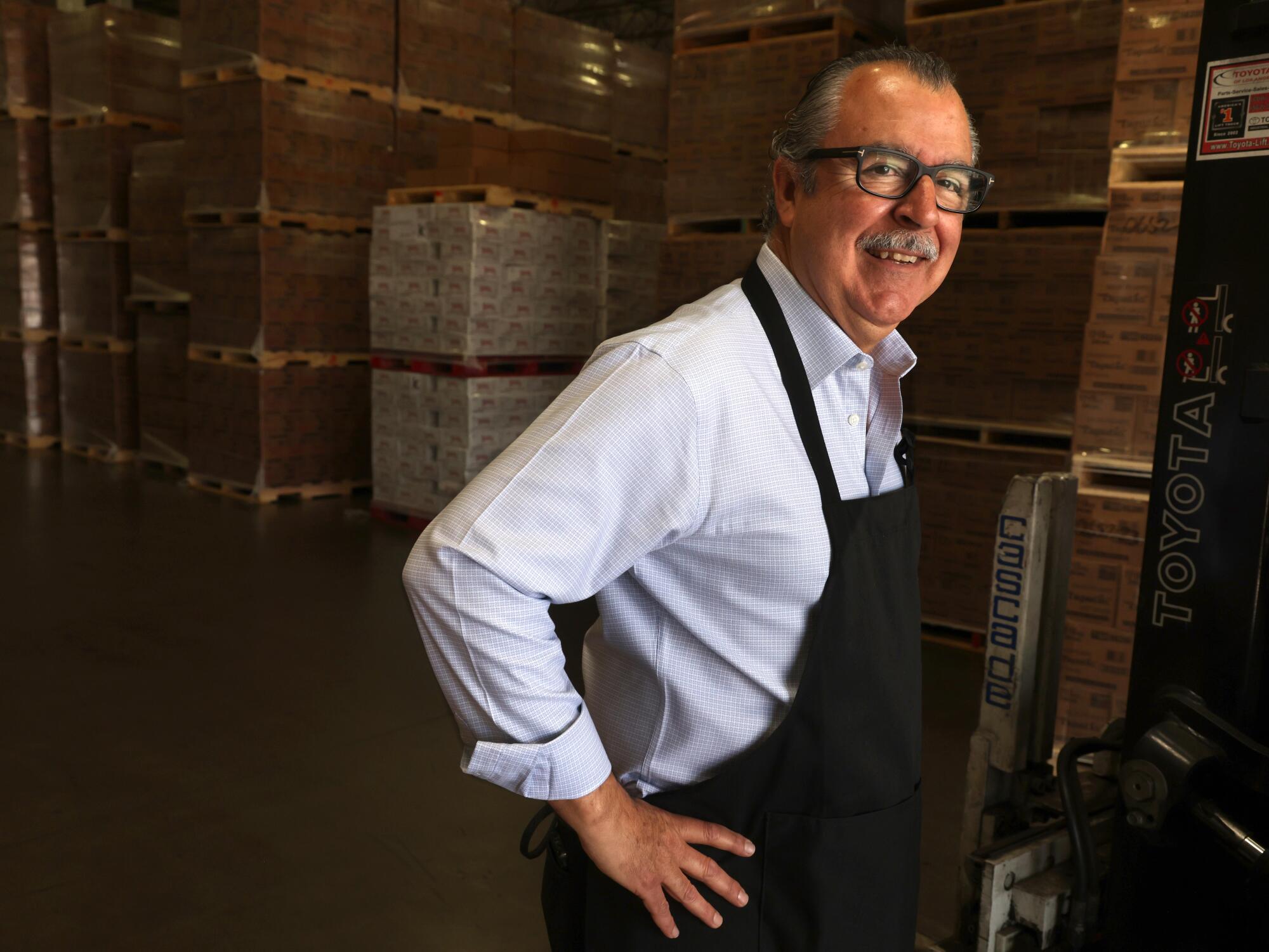 Luis Saavedra, left, former CEO of Tapatio.