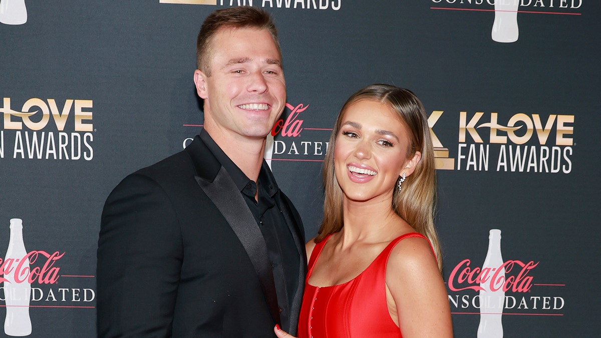 Sadie Robertson and husband Christian Huff walking red carpet at awards show
