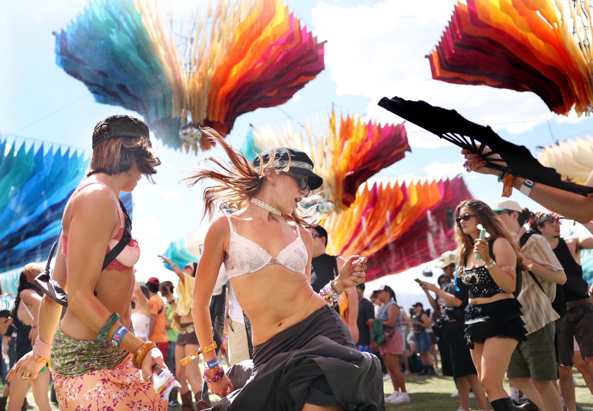 Sophia Peterson, left, and Ariana Pellegrini, of Los Angeles, dance as DJ Fifi plays at the DoLab.