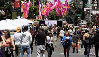 A group gathers at the Love Fest SF block party in the Tenderloin San Francisco. The neighborhood saw significant year-over-year growth in sales tax revenue in 2025, though it still lags behind its 2019 levels.