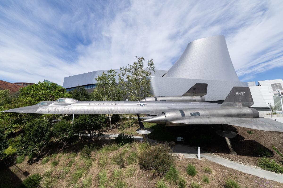 An SR-71 Blackbird is displayed in front of the Samuel Oschin Air and Space Center in Los Angeles