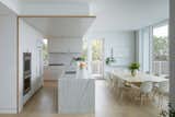 The interiors play with compression and release, as with the kitchen and dining area.