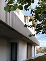 Structural roof extensions carry the roofline out over the home, eliminating the need for gutters or lintels.