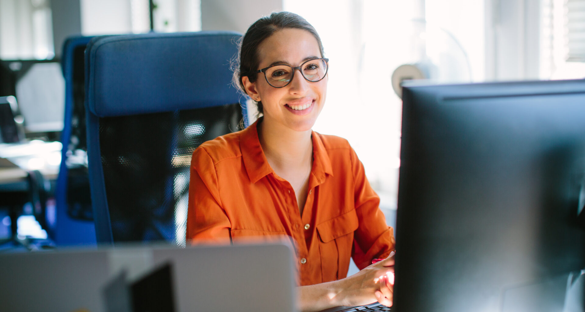 Woman employee works on her computer
