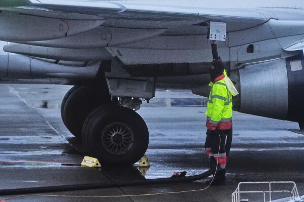 An airplane is refueled at Seattle-Tacoma International Airport in SeaTac, Wash., on Sunday, Nov. 23, 2025. (AP Photo/Lindsey Wasson, File)