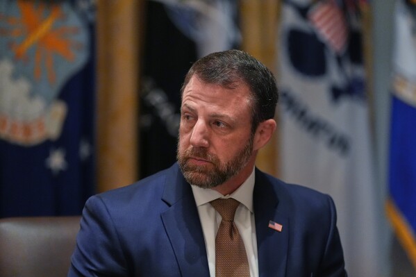 Homeland Security Secretary Markwayne Mullin listens during a Cabinet meeting at the White House, March 26, 2026, in Washington. (AP Photo/Alex Brandon)