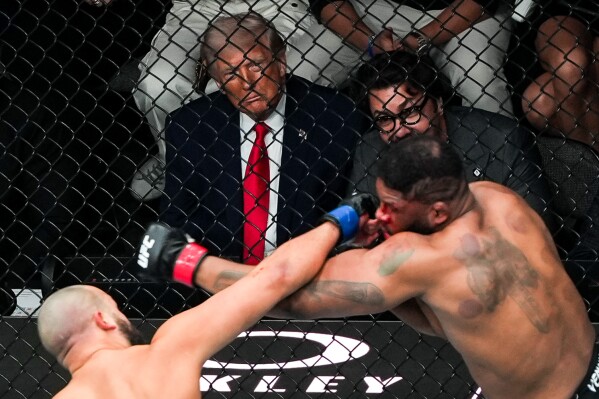 President Donald Trump and Hunter Campbell attend UFC 327 at Kaseya Center, Saturday, April 11, 2026, in Miami. (AP Photo/Julia Demaree Nikhinson, File)