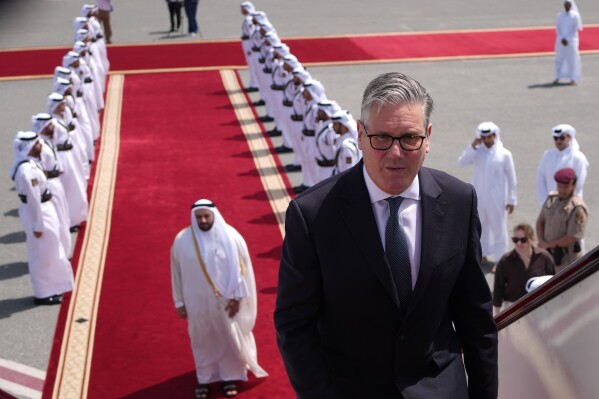 Britain's Prime Minister Keir Starmer boards a plane at the airport in Doha, Qatar, Friday, April 10, 2026 after his three day visit to the Gulf region.(AP Photo/Alastair Grant, Pool, File)