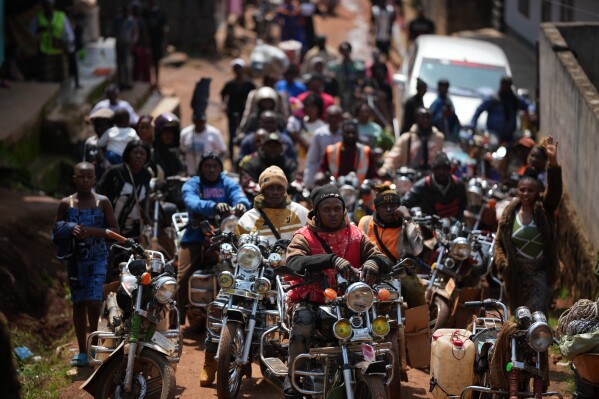 People wait for Pope Leo XIV in Bamenda, Cameroon, Thursday, April 16, 2026, on the fourth day of his 11-day pastoral visit to Africa. (AP Photo/Andrew Medichini, File)