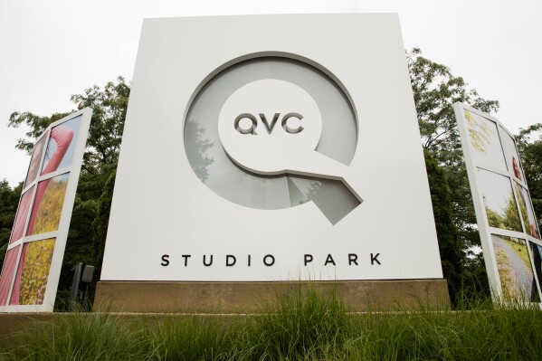 Corporate signage is shown outside a QVC facility in West Chester, Pa., Friday, July 7, 2017. (AP Photo/Matt Rourke, File)