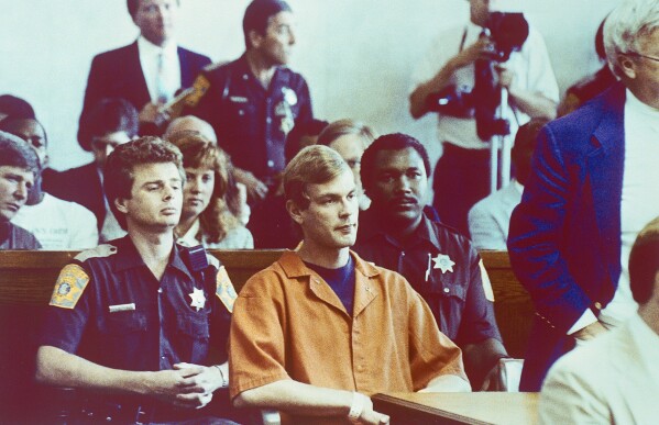 Suspected serial killer Jeffrey L. Dahmer sits in court for a hearing where he was charged with eight additional counts of first degree intentional homicide, bringing the total to 12, Aug. 7, 1991. (AP Photo/Jack Orton/Pool, File)