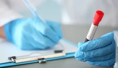 scientist looking at blood sample