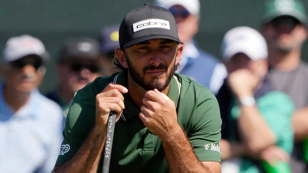 Max Homa lining up a putt on the first green at Augusta National Golf Club