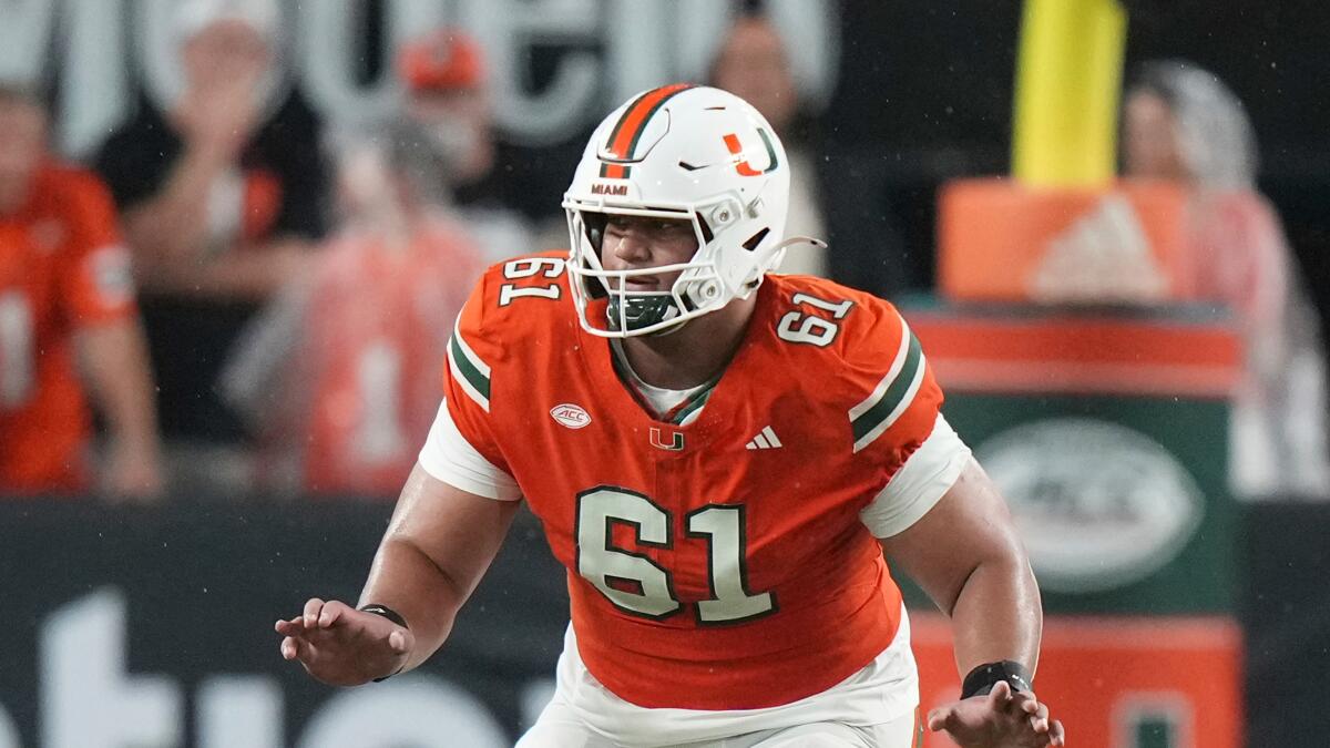 Miami offensive lineman Francis Mauigoa blocks (61) blocks against Notre Dame on Aug. 31.