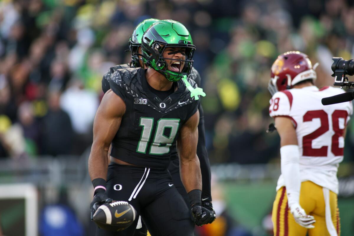 Oregon tight end Kenyon Sadiq celebrates after scoring a touchdown against USC on Nov. 22.