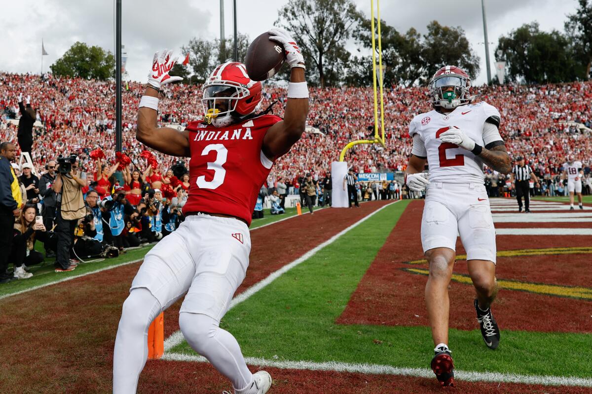 Indiana receiver Omar Cooper Jr. celebrates after catching a touchdown pass in front of Alabama defensive back Zabien Brown.