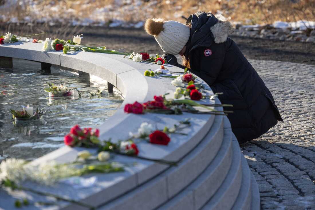 A mourner visits the Sandy Hook Permanent Memorial on the 10th anniversary of the school shooting on Dec.14, 2022 in Newtown, Connecticut. Twenty-six people were shot and killed, including 20 first graders and 6 educators, in one of the deadliest elementary school shootings in U.S. history.