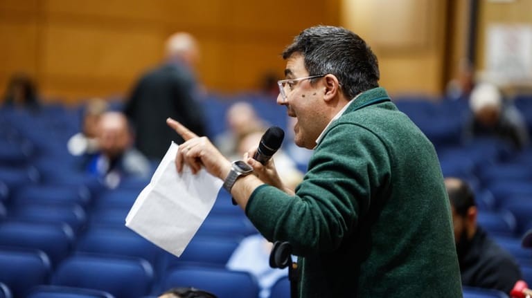 Kerim Odekon, of Brookhaven, addresses the board during a meeting...