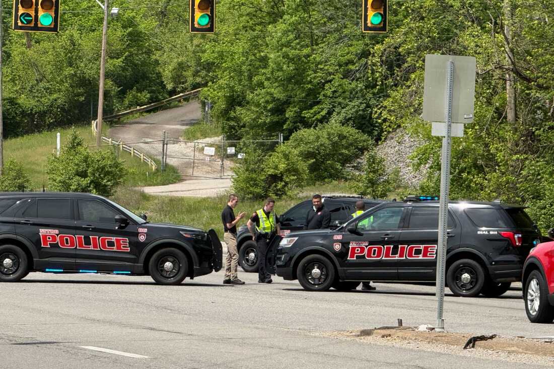 Police block a road near a chemical plant where a leak occurred Wednesday in Institute, W.Va.