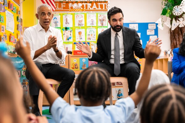 Former President Barack Obama and Mayor Zohran Mamdani sing "Wheels on the Bus" to children at Learning Through Play Pre-K in the Bronx in New York, Saturday, April 18, 2026. (AP Photo/Angelina Katsanis, File)