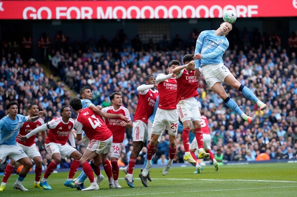 Manchester City's Erling Haaland heads the ball during the English Premier League soccer match between Manchester City and and Arsenal, in Manchester, England, Sunday, April 19, 2026. (AP Photo/Dave Thompson, File)