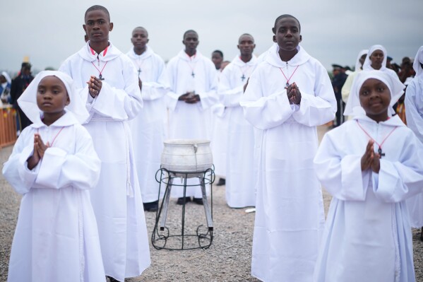 Faithful wait for Pope Leo XIV at Yaounde Ville Airport, Cameroon, Saturday, April 18, 2026 on the sifth day of his 11-day pastoral visit to Africa. (AP Photo/Andrew Medichini, File)
