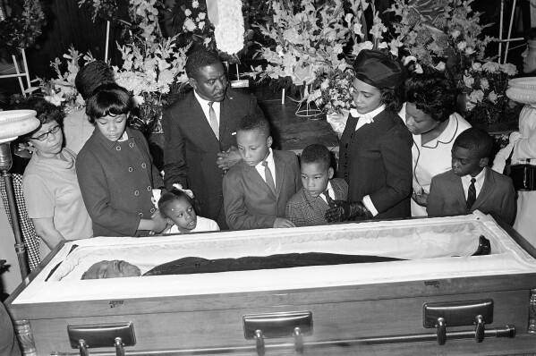 Coretta Scott King, third right, is accompanied by her children, Yolanda, Bernice, Martin III, and Dexter at Sisters Chapel on the campus of Spellman College in Atlanta, April 8, 1968. (AP Photo/Jack Thornell, File)