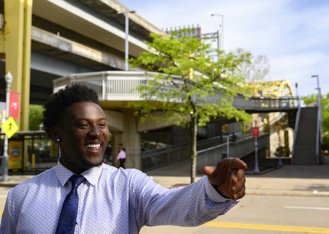 PITTSBURGH-APRIL 21: Amir Grigsby, 22, talks sports allegiances along North Shore Drive outside Acrisure Stadium on Tuesday, April 21, 2026 in Pittsburgh, Pennsylvania.(Jeff Swensen for NPR)