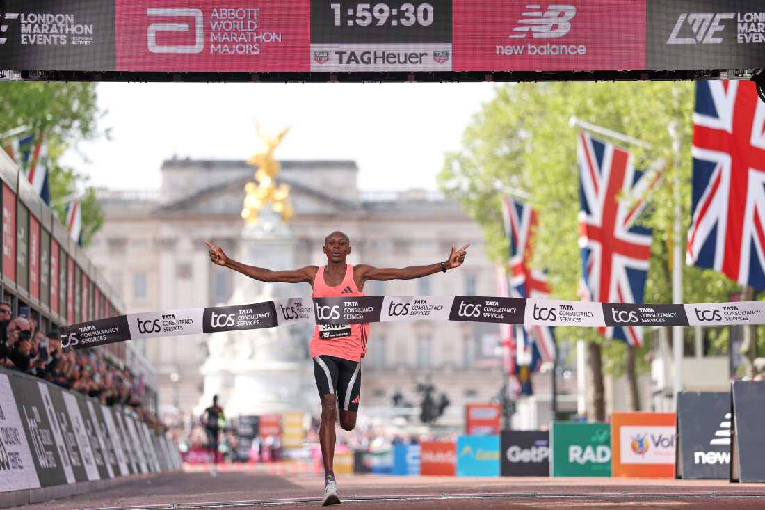Sebastian Sawe from Kenya crosses the finish line to win the men's race at the London Marathon in London, Sunday, April 26, 2026.