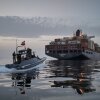 In this photo released by Tasnim News Agency, a Revolutionary Guard Navy (IRGC) speedboat approaches the cargo ship Epaminondas during what state media described as the seizure of one of two vessels accused of violations in the Strait of Hormuz, April 21, 2026.
