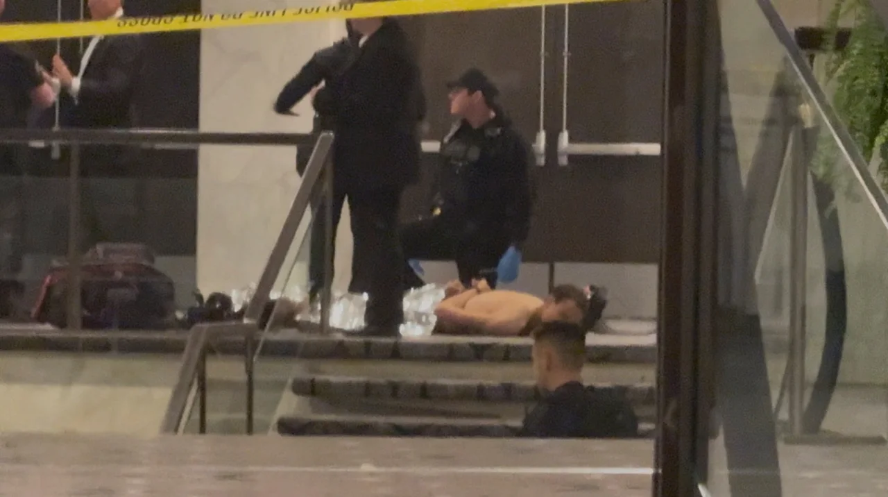 Cole Tomas Allen, a suspect in the shooting incident at the White House Correspondents' Association dinner, lies on the floor after being detained by law enforcement personnel, in Washington, D.C., U.S., April 25, 2026, in this screengrab from a video.