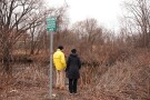 David Stoff and Ann McDonald, activists, look out at the water in the Alewife Brook Reservation by a sewage outfall on Friday, March 13, 2026, in Cambridge, Mass. (Lucie McCormick/MIT Graduate Program in Science Writing via AP)