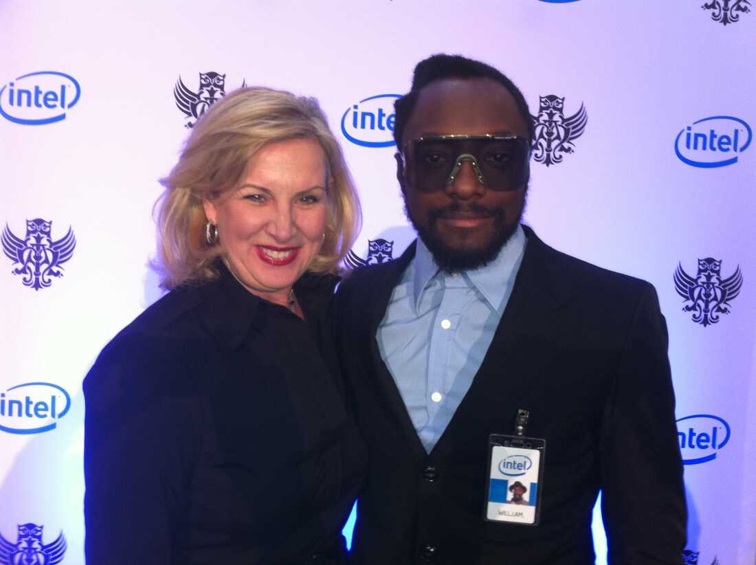 Intel's Deborah Conrad and will.i.am on stage announcing his appointment as director of creative innovation in Jan. 2011, at the company's international sales and marketing conference.